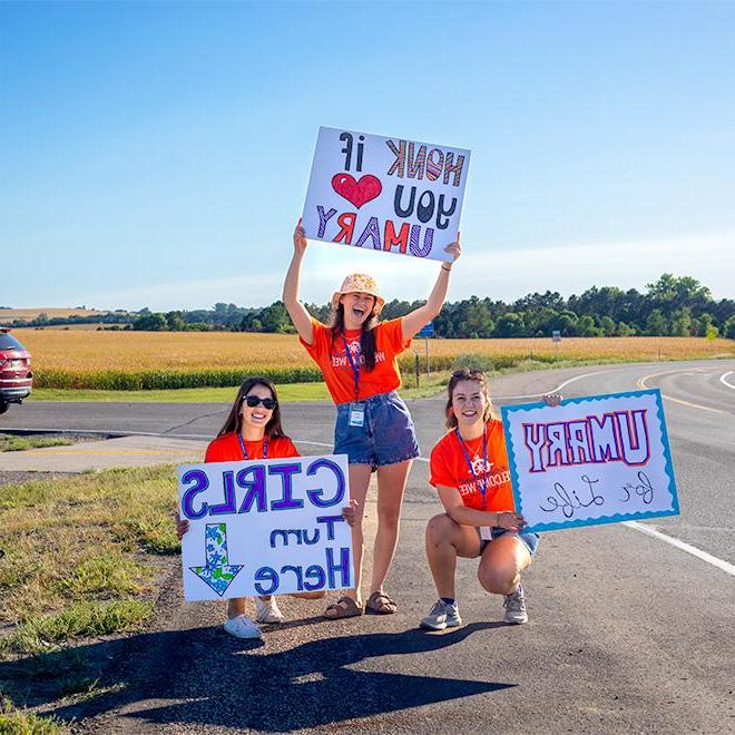 Students welcoming new students on campus